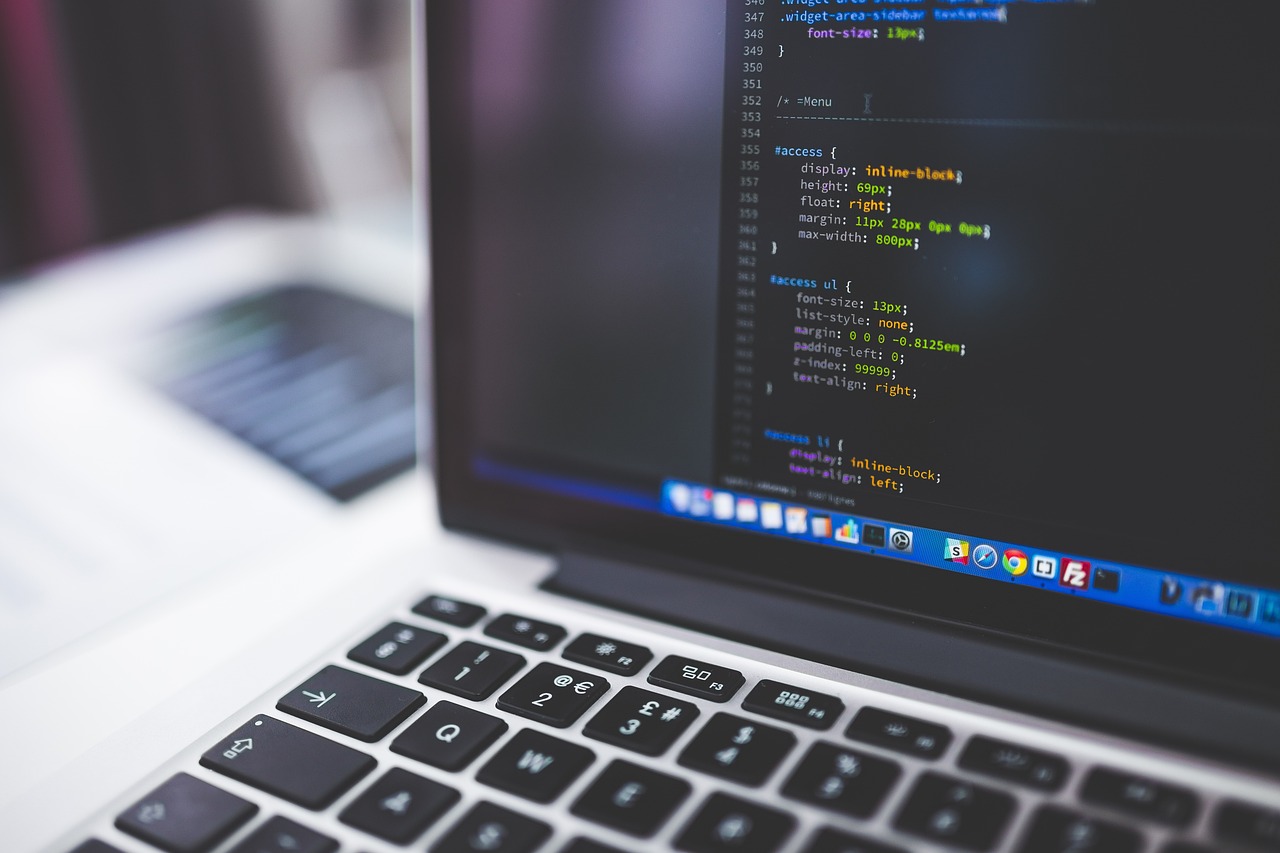 Entrepreneur comparing QuickBooks Online setup options on laptop