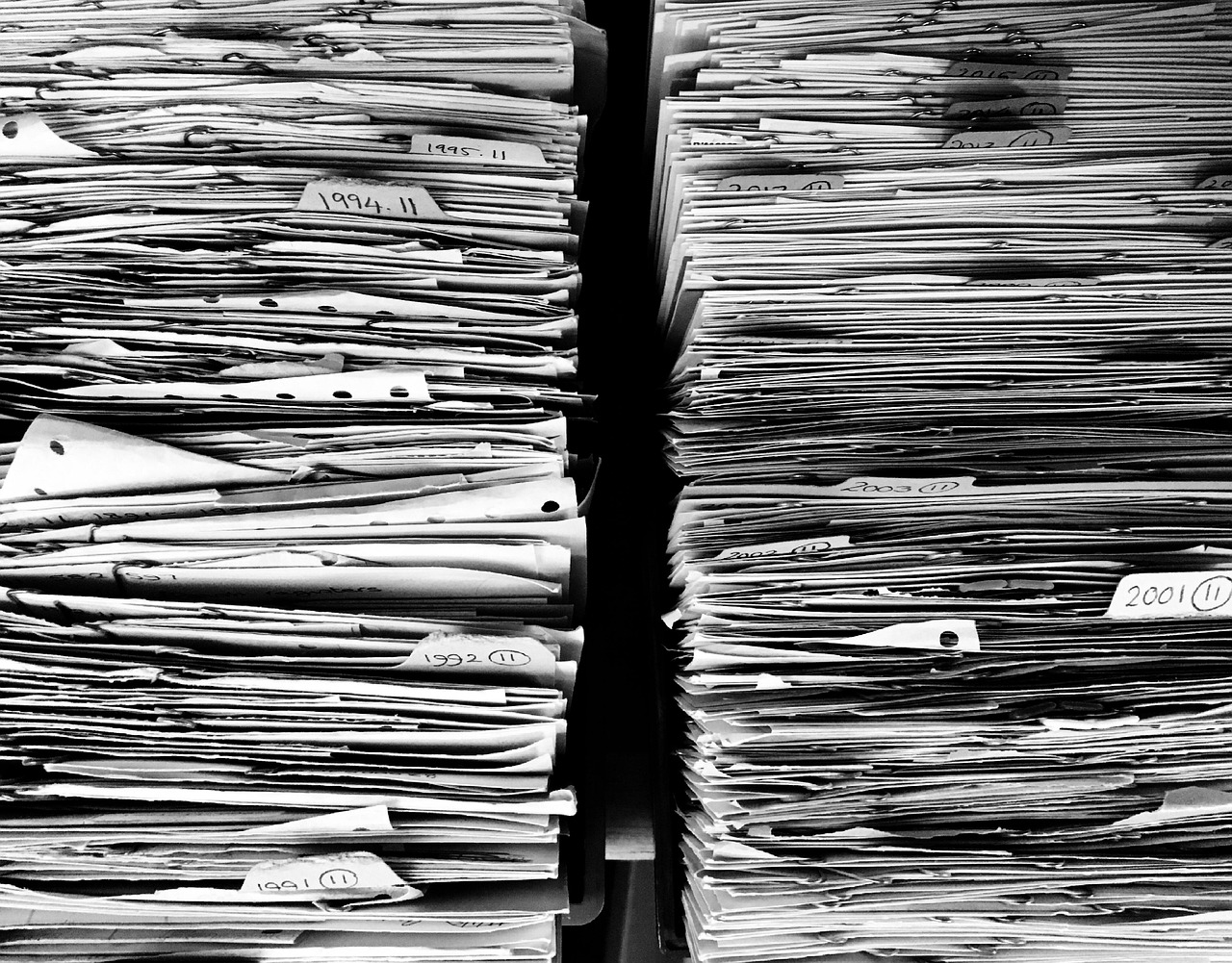 Messy disorganized business files and receipts needing cleanup